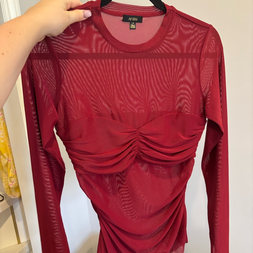 Revolve going out top